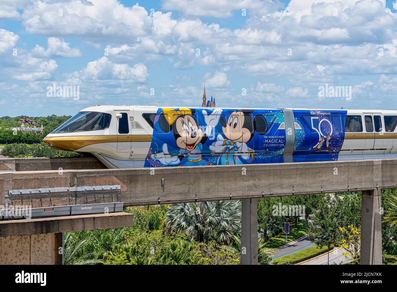 Monorail Gold 50th celebration train at Disney World resort in Florida Stock Photo