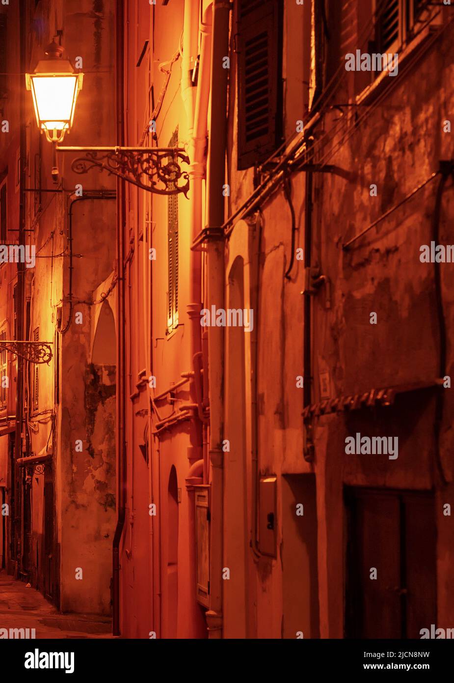 Night narrow street with vintage lanterns, Sanremo, Italy Stock Photo