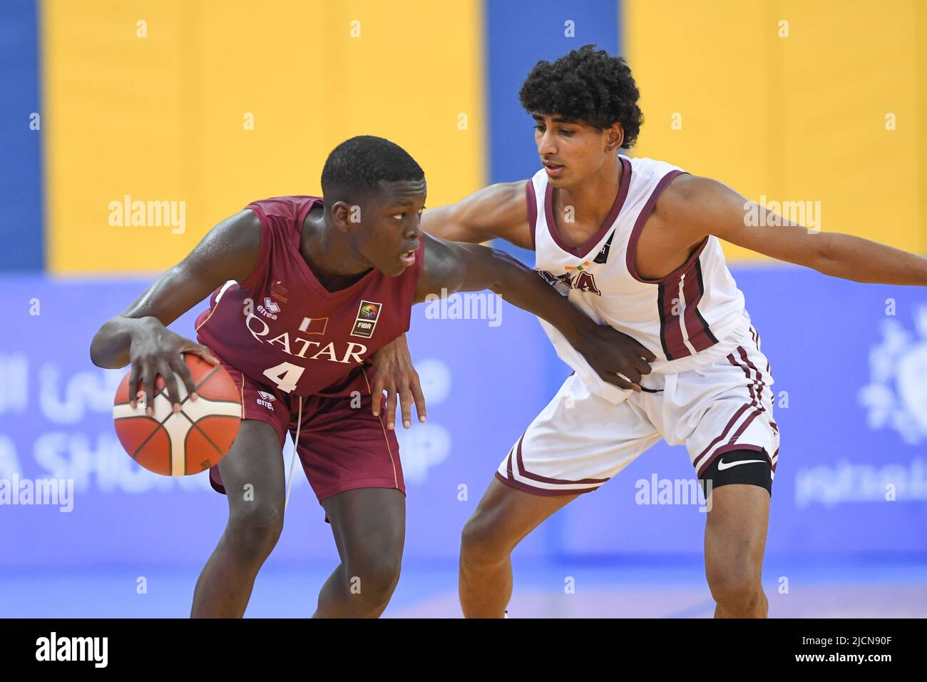 Doha, Qatar. 14th June, 2022. Mohamed Massamba Ndao (L) of the Qatar