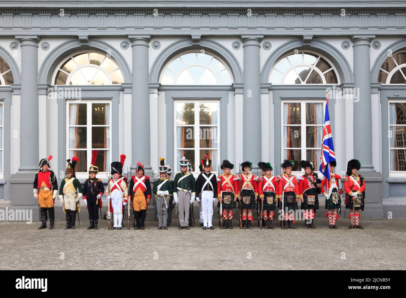 Various French, Belgian, Dutch and British soldiers and gendarmes during the Duchess of Richmond's ball at Egmont Palace in Brussels, Belgium Stock Photo