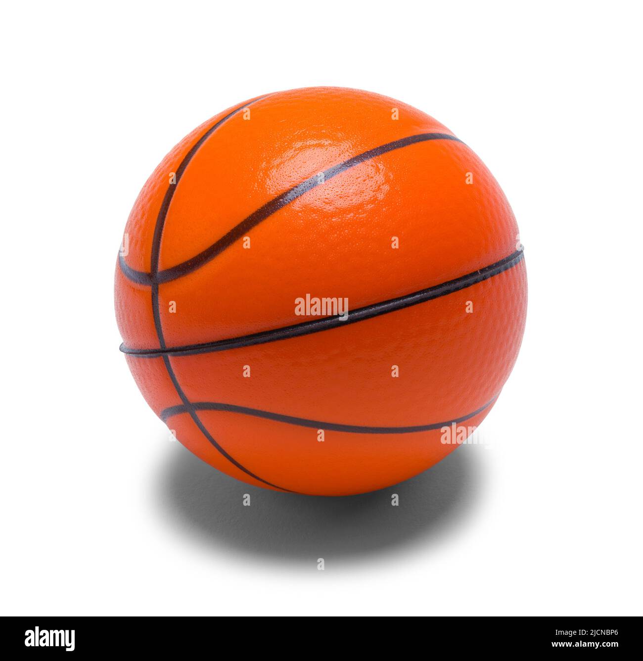 Tiny Toy Basketball Cut Out on White. Stock Photo