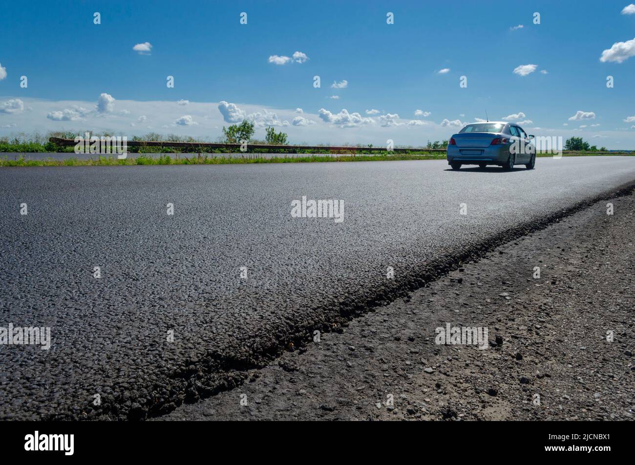 Scenic view on the gravel road with stones and vegetation on roadsides, selective focus. High quality photo Stock Photo