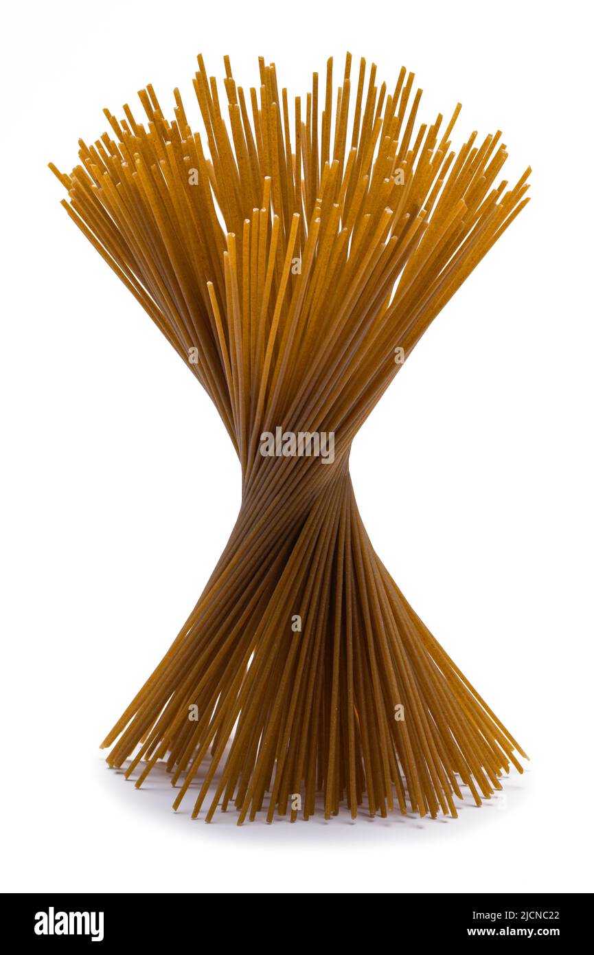 Spiral Bunch of Whole Wheat Noodles Cut Out on White. Stock Photo