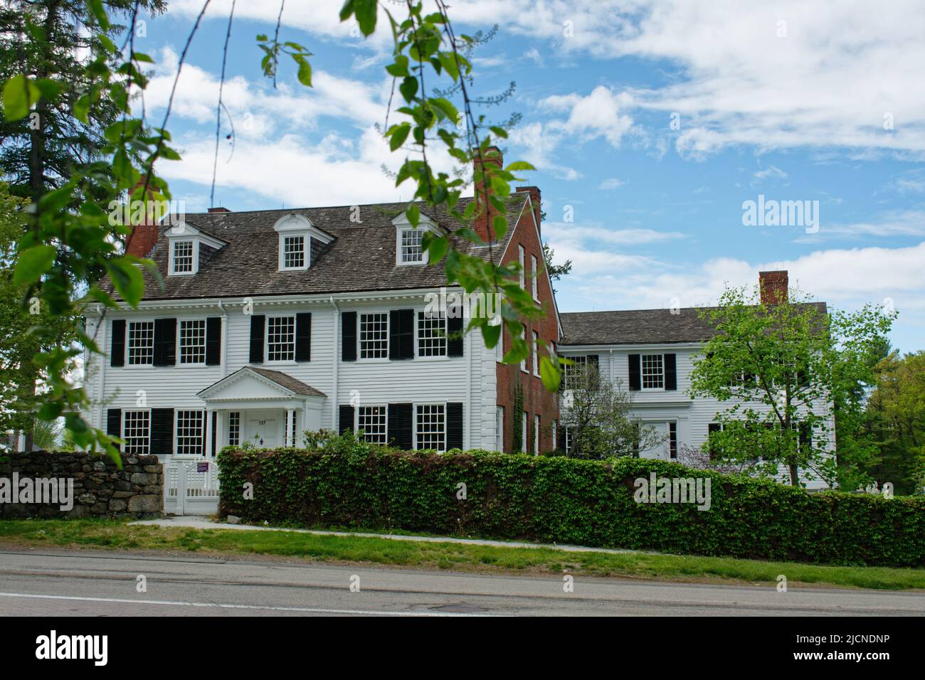 Front view of the StevensCoolidge house and garden from the street