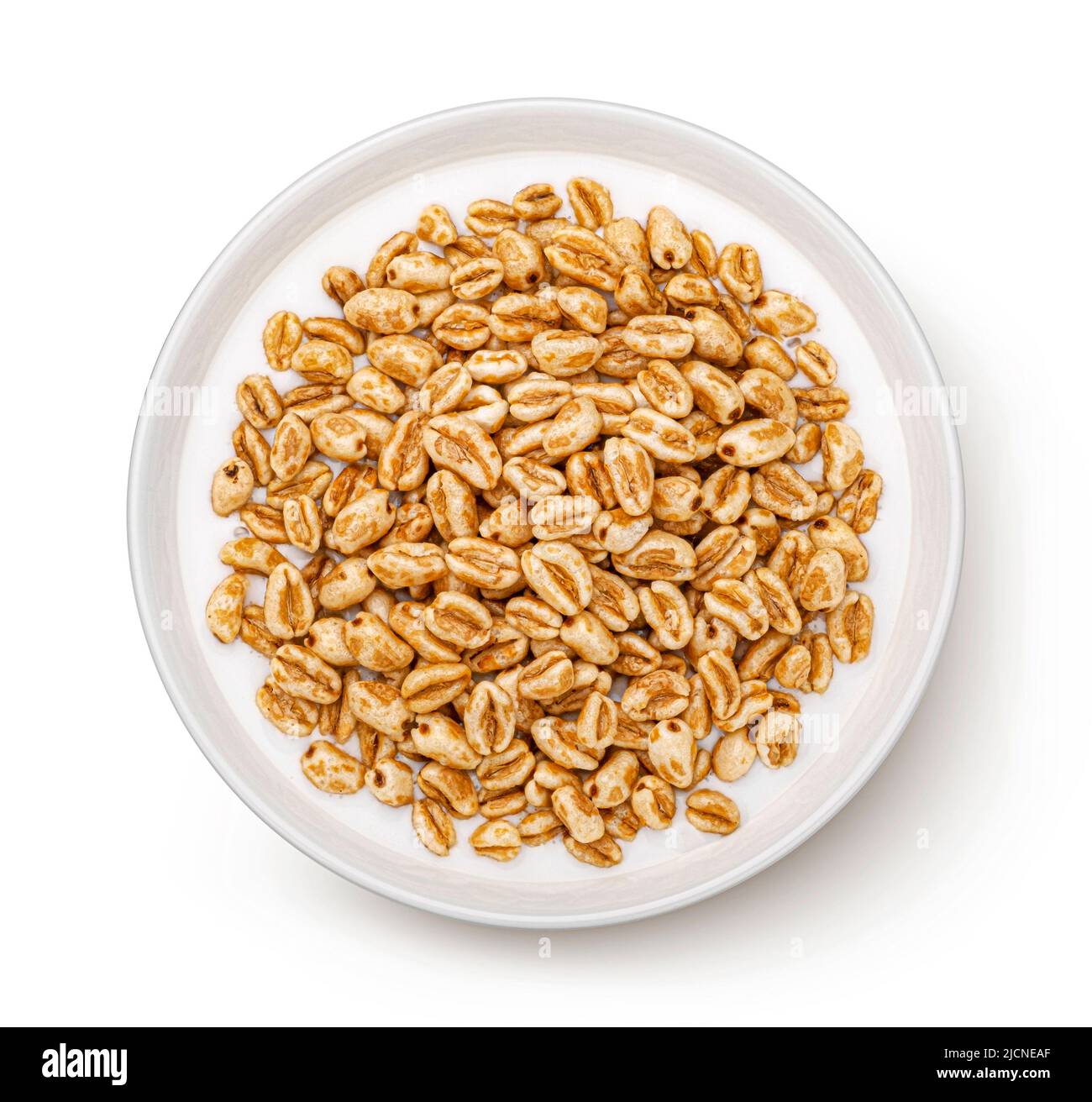 Puffed wheat cereal isolated on white, top view Stock Photo - Alamy