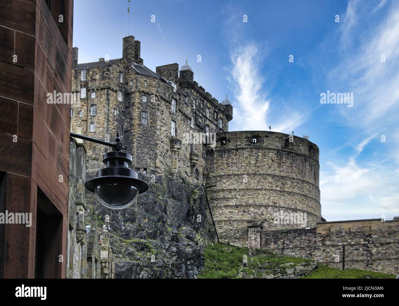 Edinburgh Castle is an ancient fortress, which from its position on top of the castle rock, dominates the panorama of the city of Edinburgh. Stock Photo