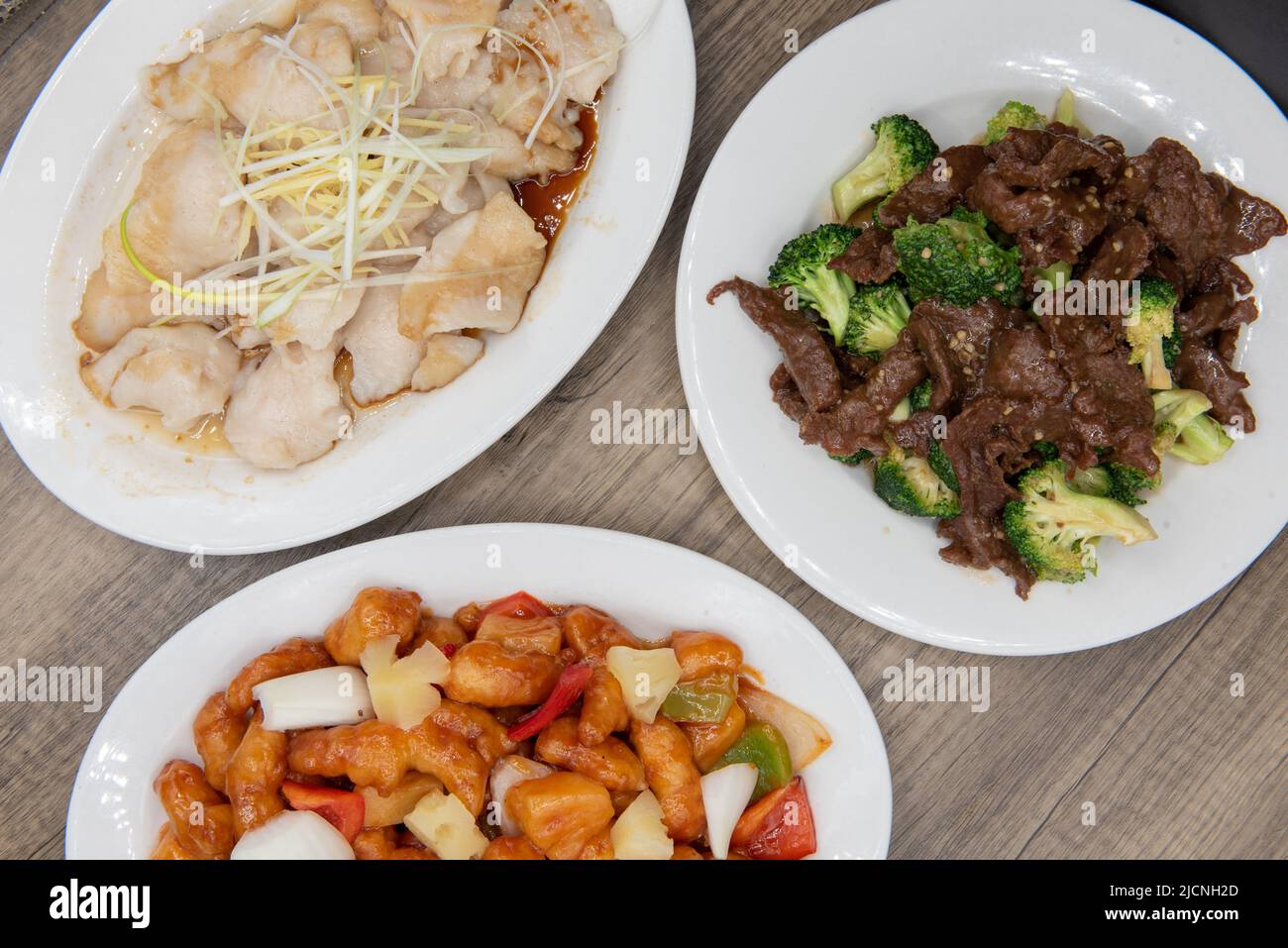 Overhead view of temping choices of meals with the beef and broccoli featured, for a great Chinese food meal. Stock Photo