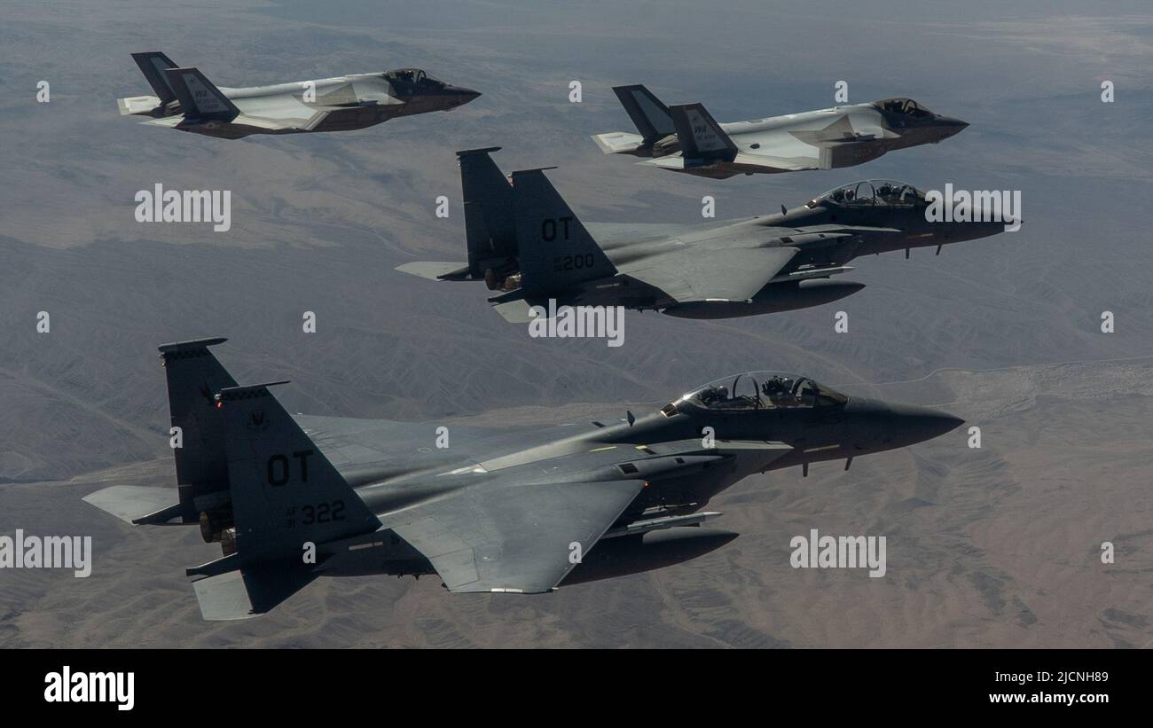 Two F-35A Lightning IIs and two F-15 Strike Eagles fly in a formation ...
