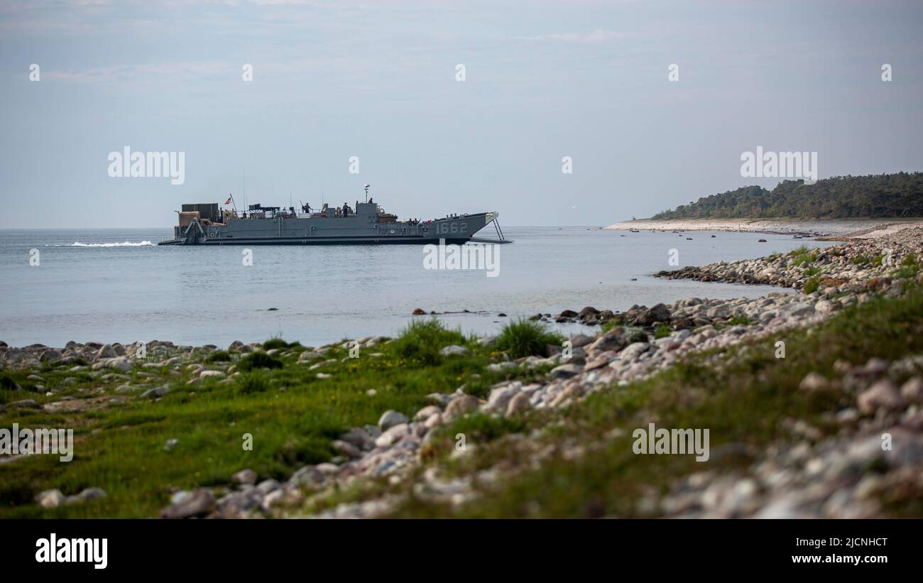 Landing Craft Utility (LCU 1662) unloads equipment and personnel during a training exercise at Gotland Island as part of Baltic Operations 2022, June 7, 2022. BALTOPS 22 is the premier maritime-focused exercise in the Baltic Region. The exercise, led by U.S. Naval Forces Europe-Africa, and executed by Naval Striking and Support Forces NATO, provides a unique training opportunity to strengthen combined response capabilities critical to preserving freedom of navigation and security in the Baltic Sea. (U.S. Marine Corps photo by Staff Sgt. Timothy A. Turner) Stock Photo