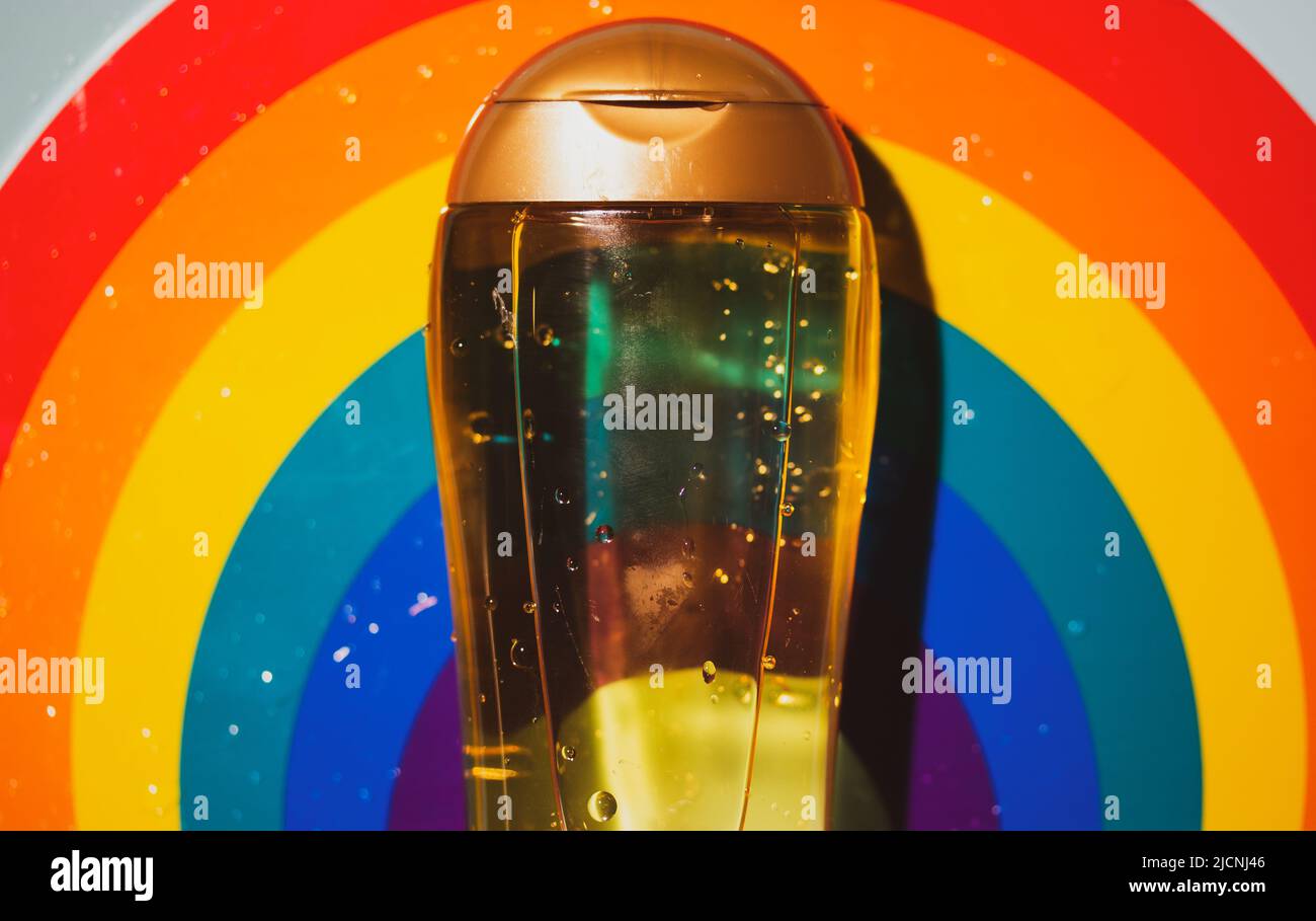 Summer suntan body tanning SPF oil. Cosmetic for face hair on rainbow