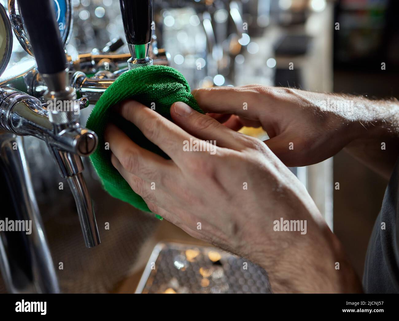 Close up of beer taps in row. Metallic equipment for bars and mini