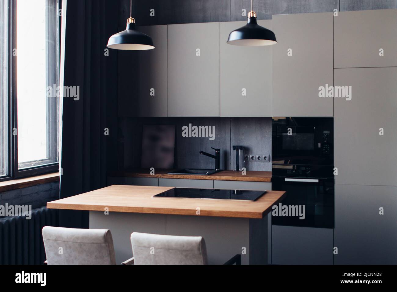 Modern kitchen interior design with furniture and table Stock Photo Alamy