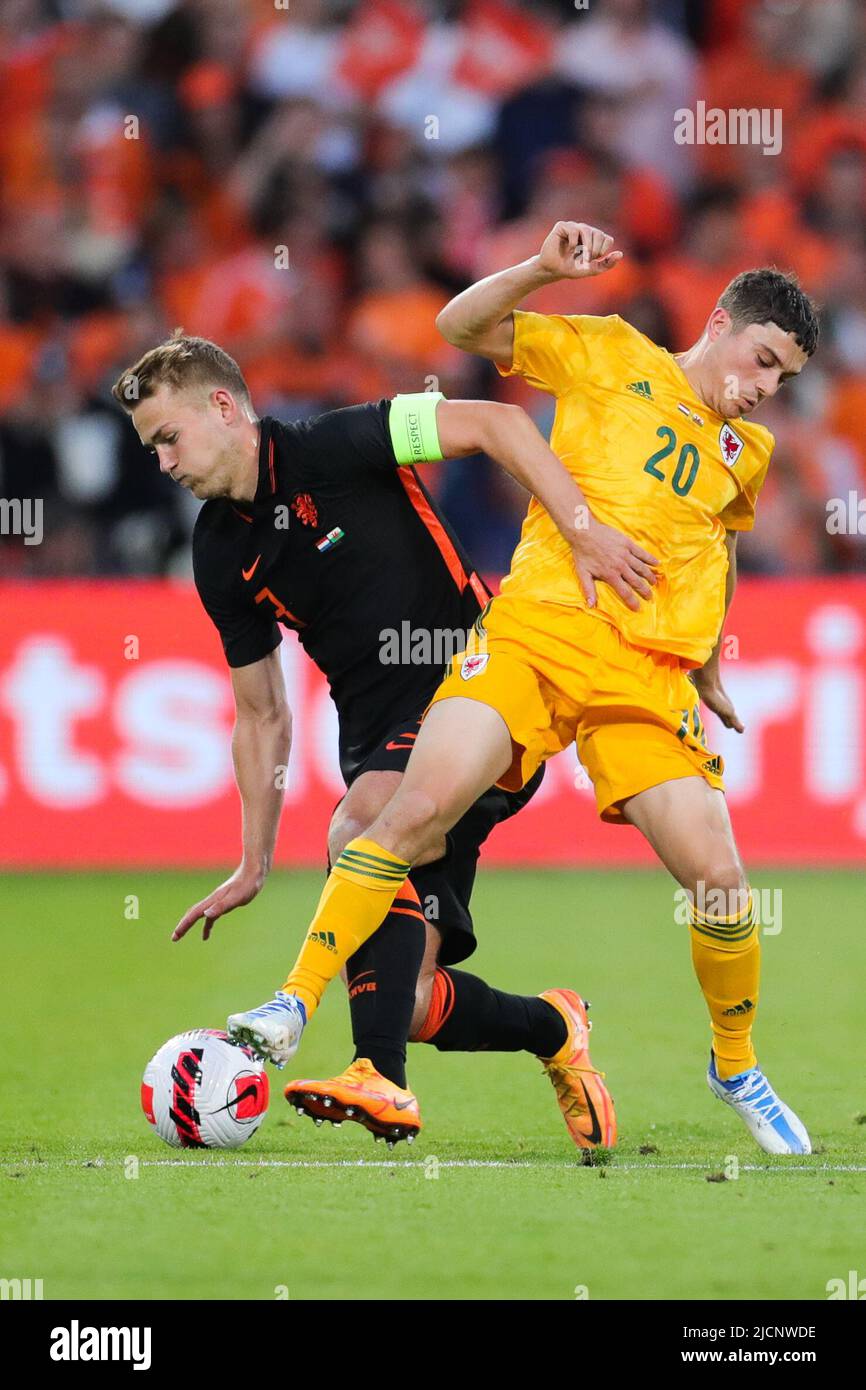 Rotterdam, Netherlands. 14th June, 2022. Matthijs de Ligt (L) of the Netherlands vies with Daniel James of Wales during the football match of Group 4 in League A of the UEFA Nations League between the Netherlands and Wales in Rotterdam, the Netherlands, June 14, 2022. Credit: Zheng Huansong/Xinhua/Alamy Live News Stock Photo