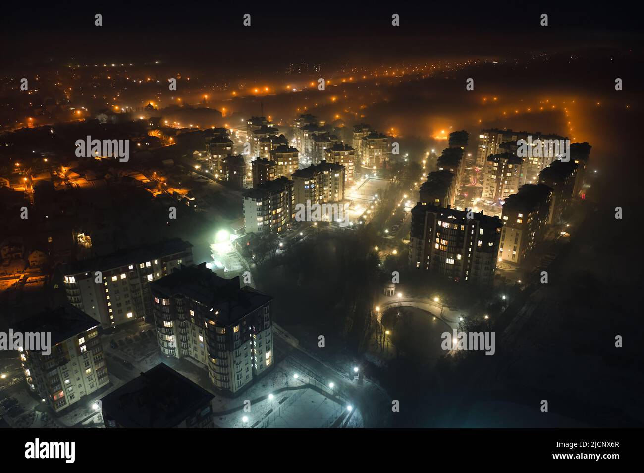 Aerial view of high rise apartment buildings and bright illuminated ...