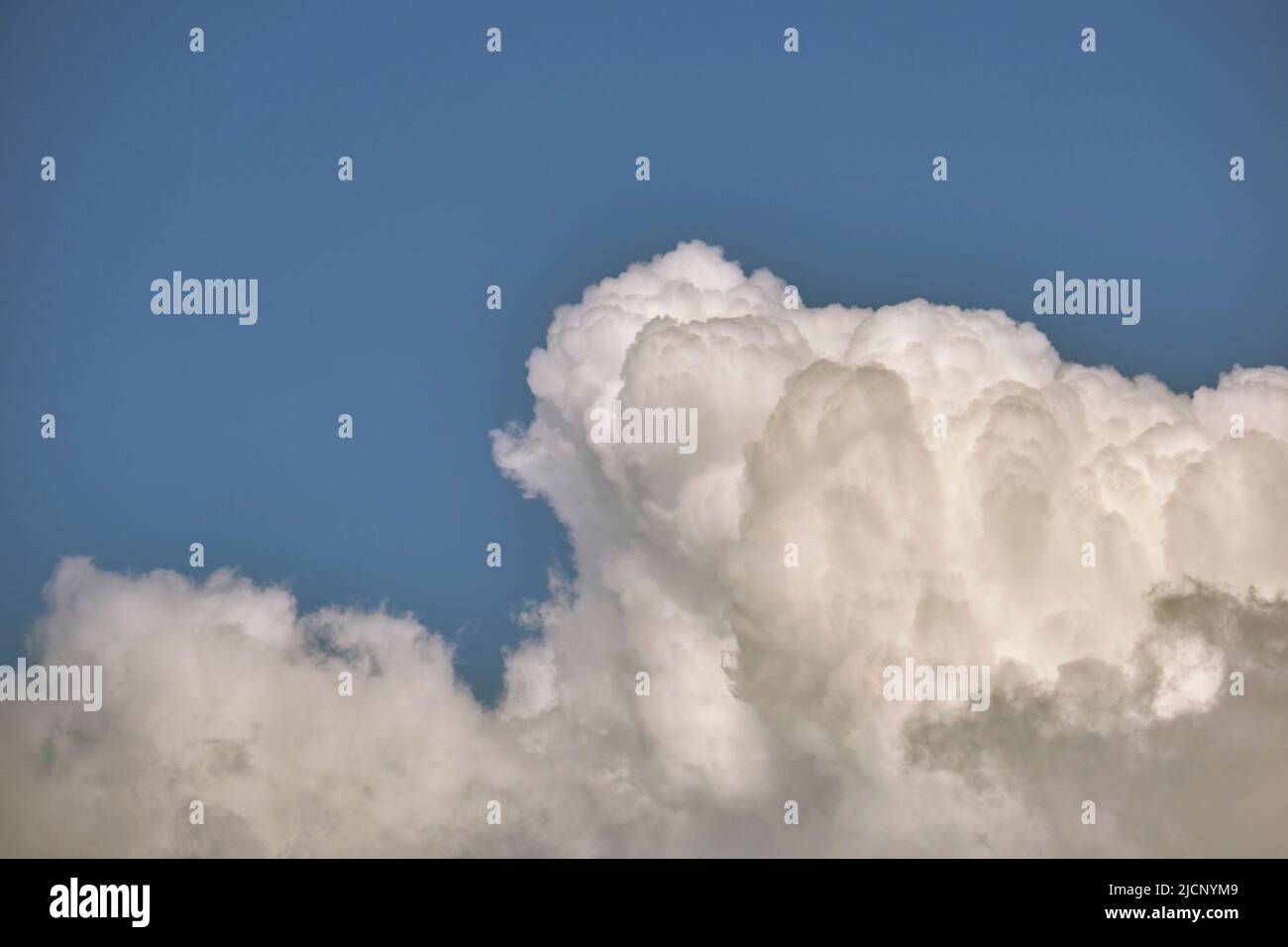 White puffy cumulus clouds on summer blue sky Stock Photo - Alamy