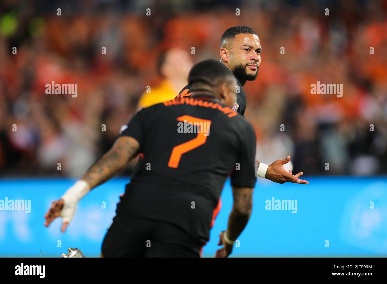 Rotterdam, Netherlands. 14th June, 2022. Memphis Depay (rear) of the Netherlands celebrates scoring during the football match of Group 4 in League A of the UEFA Nations League between the Netherlands and Wales in Rotterdam, the Netherlands, June 14, 2022. Credit: Zheng Huansong/Xinhua/Alamy Live News Stock Photo