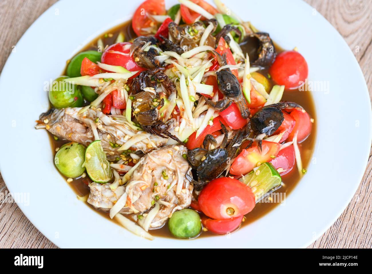 Papaya salad with crab on white plate , Thai food papaya salad spicy ...