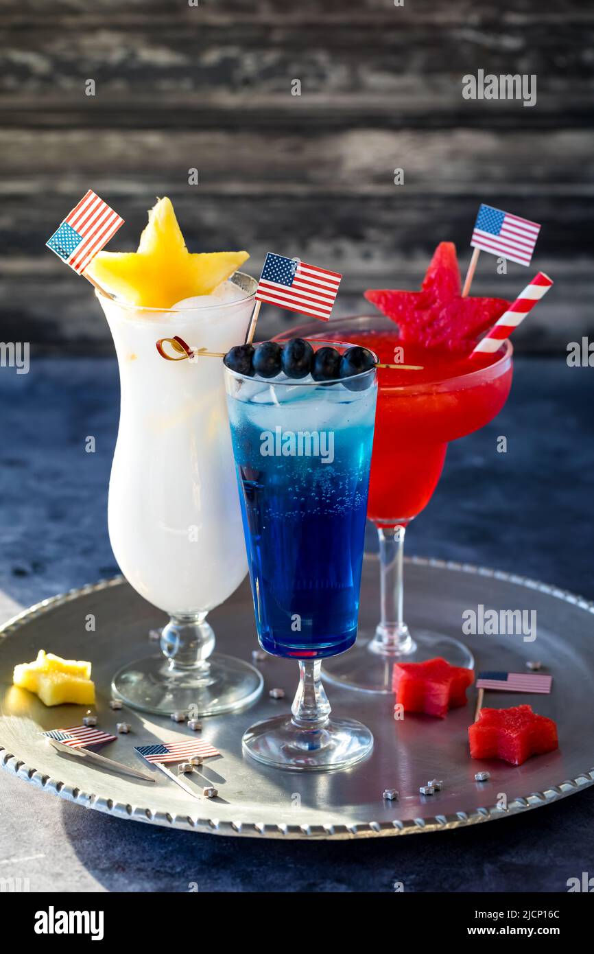 Close up of red, white and blue cocktails on a tray to celebrate 4th of July. Stock Photo