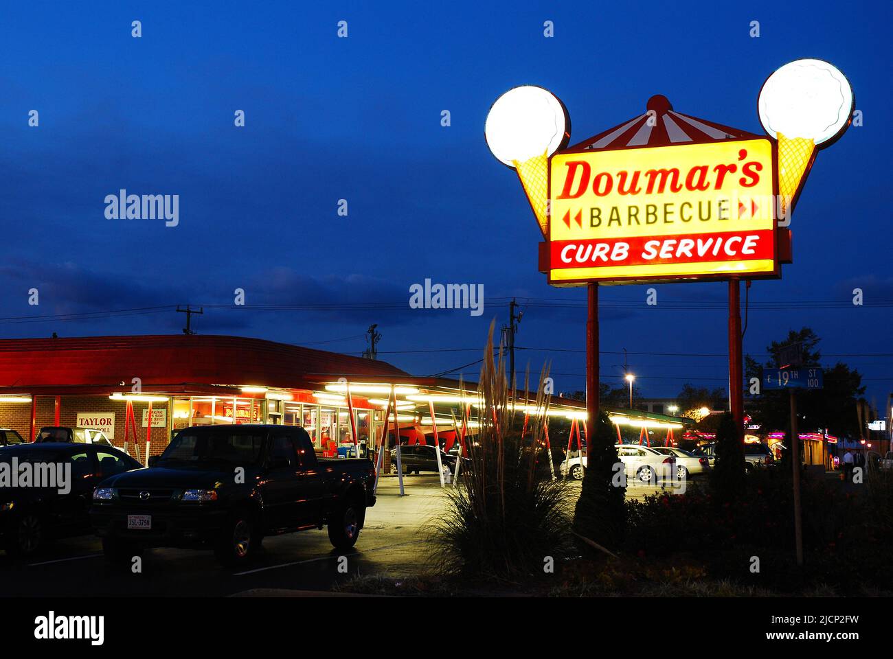 A sign outside of Doumars, in Norfolk, Virginia wecomes diners to the ice cream parlor at night Stock Photo