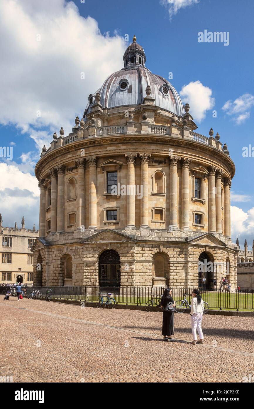 6 June 2019: Oxford, UK - Tourists at the Radcliffe Camera, famous academic library attached to Oxford University, designed by James Gibbs in neo-clas Stock Photo