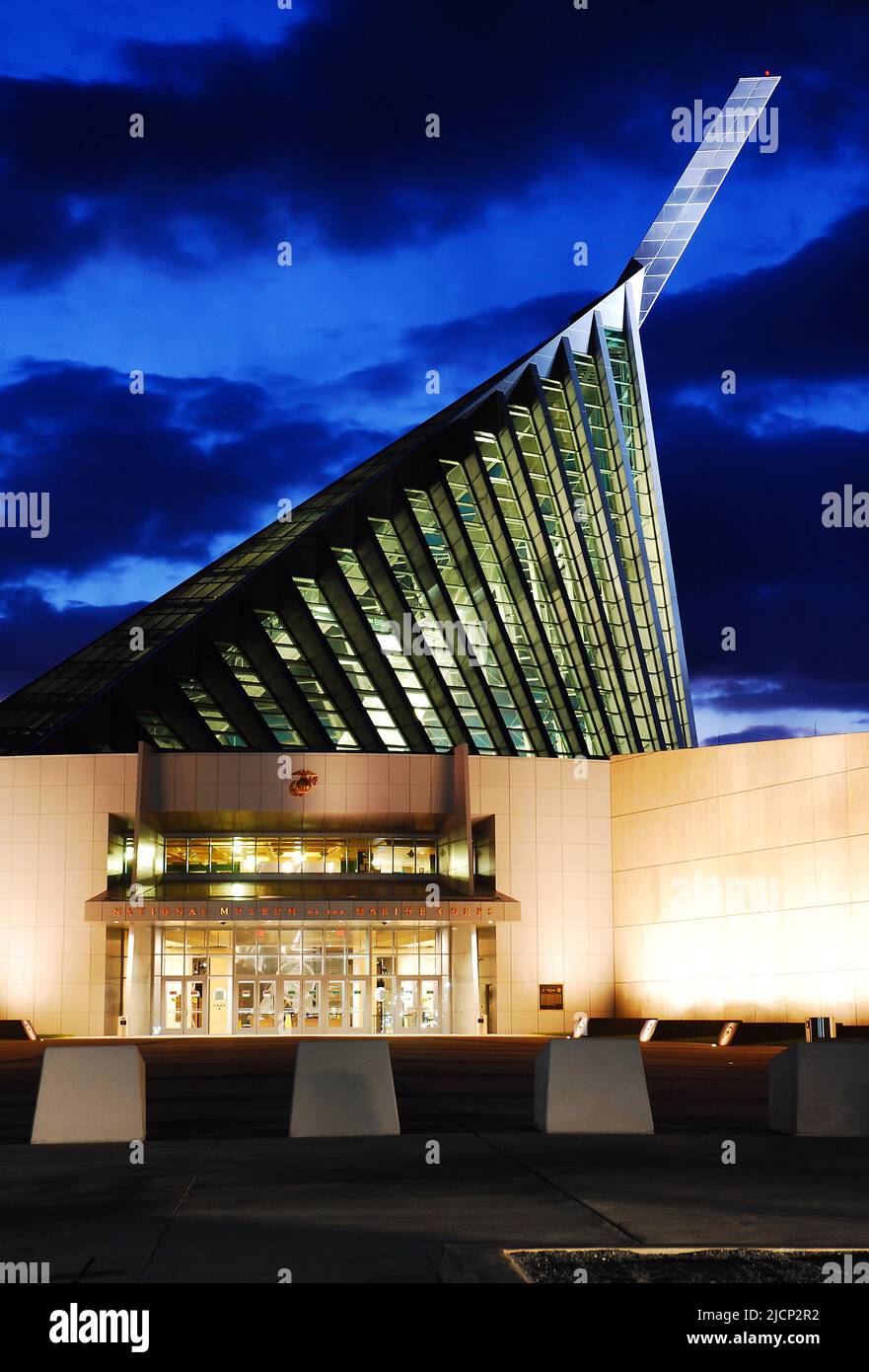 The National Museum of the marine Corp honors those who served in the American military Corp and is illuminated at night Stock Photo