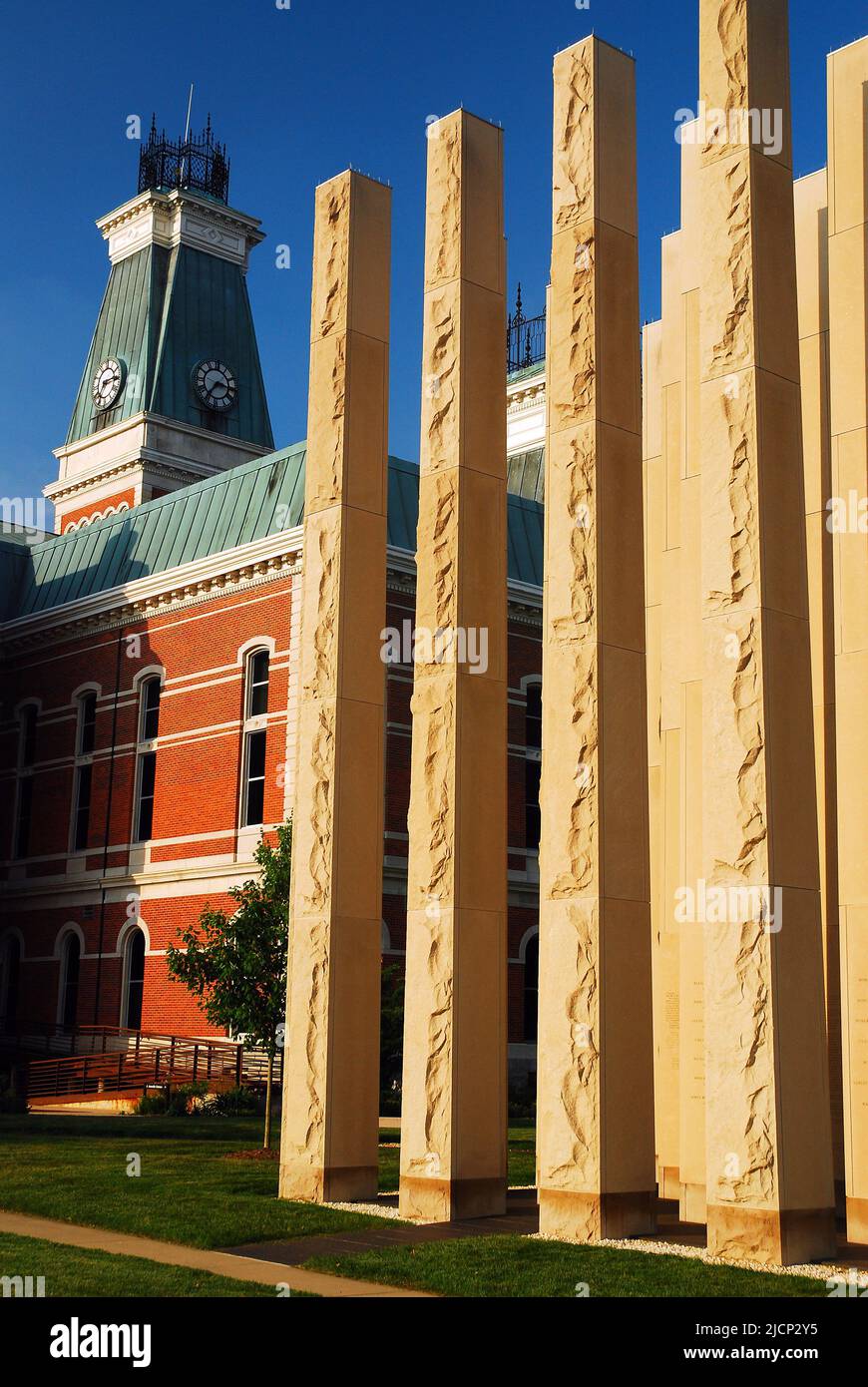 Tall stone pillars on the grounds of the Bartholomew County Courthouse serve as the county's Veterans Memorial in Columbus Indiana Stock Photo