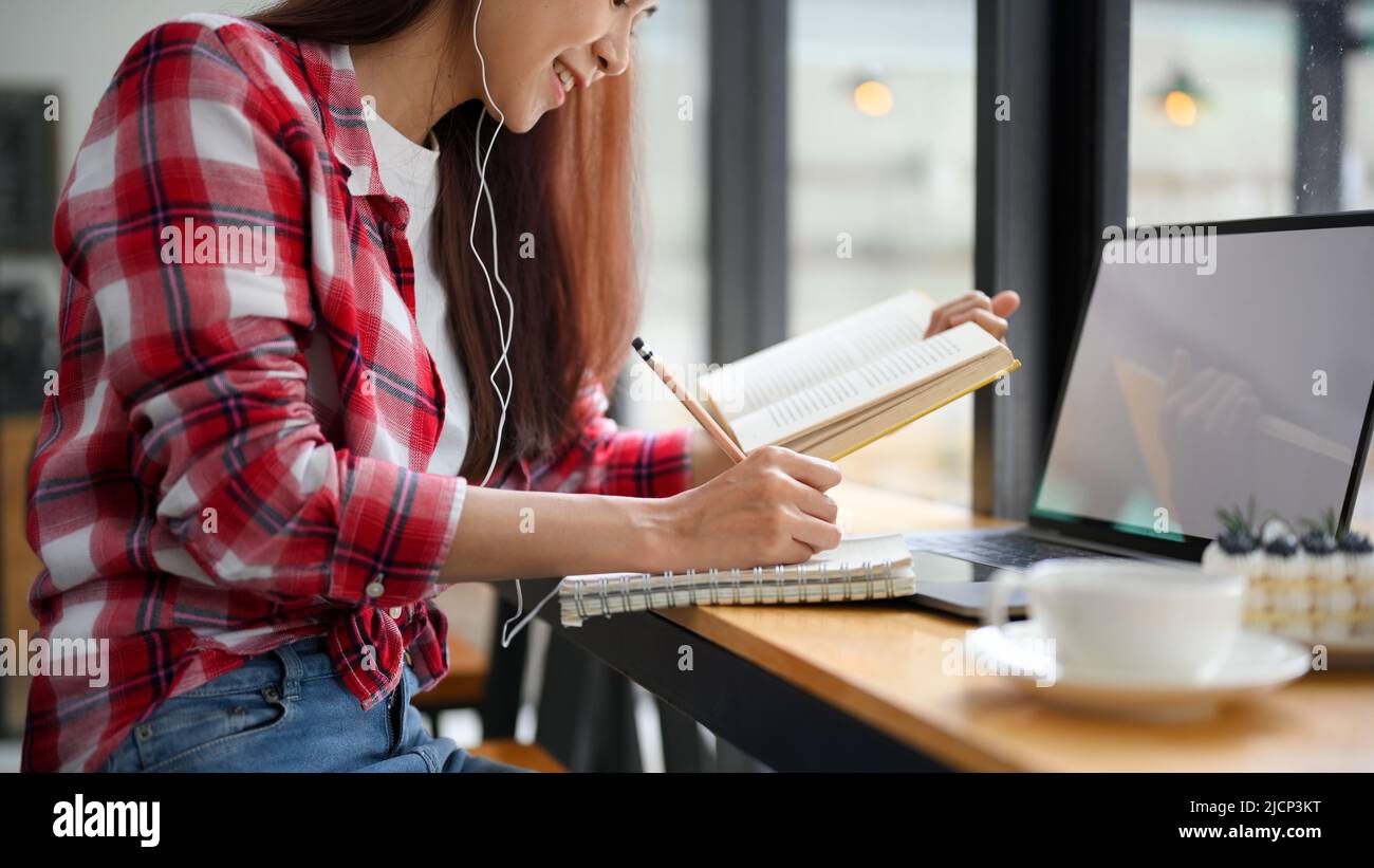Beautiful teens Asian female college student doing her homework, work ...