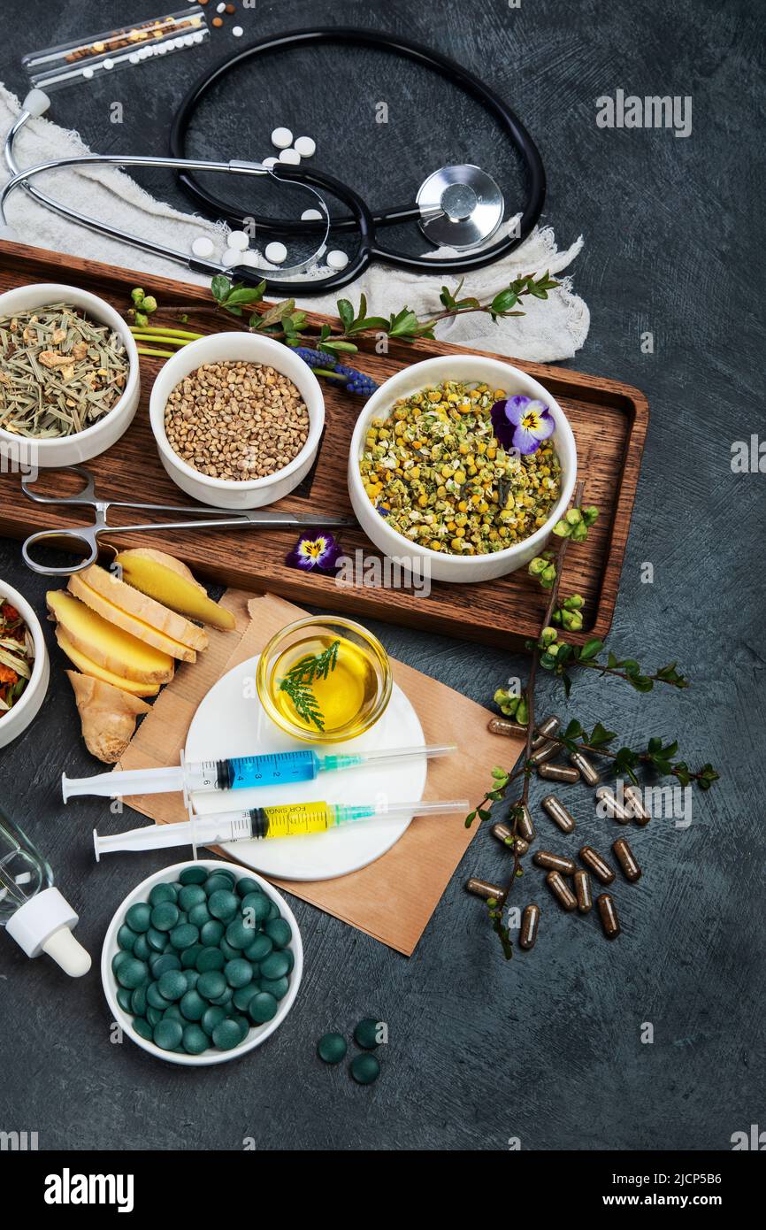 Assortment of herbal and traditional medicine. Traditional healthcare concept. Natural homoeopathic remedies. Top view, flat lay, copy space Stock Photo