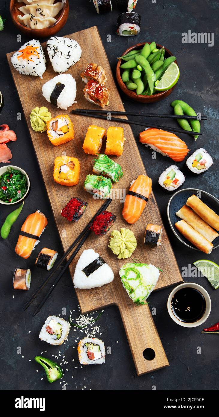 Japanese food assortment on dark background. Traditional food concept. Dishes and appetizers of indeed cuisine. Top view, flat lay Stock Photo