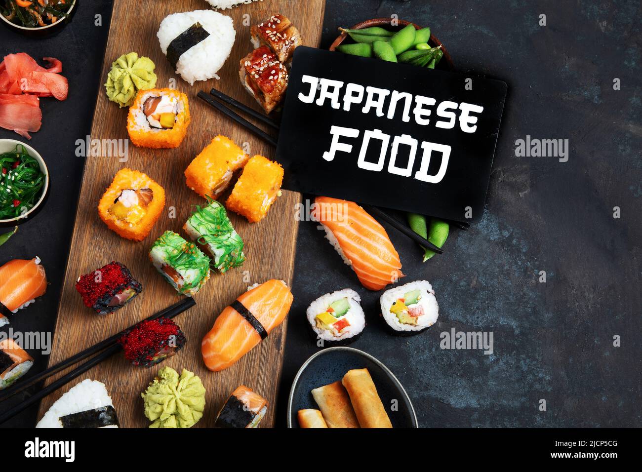 Japanese food assortment on dark background. Traditional food concept. Dishes and appetizers of indeed cuisine. Top view, copy space, flat lay Stock Photo