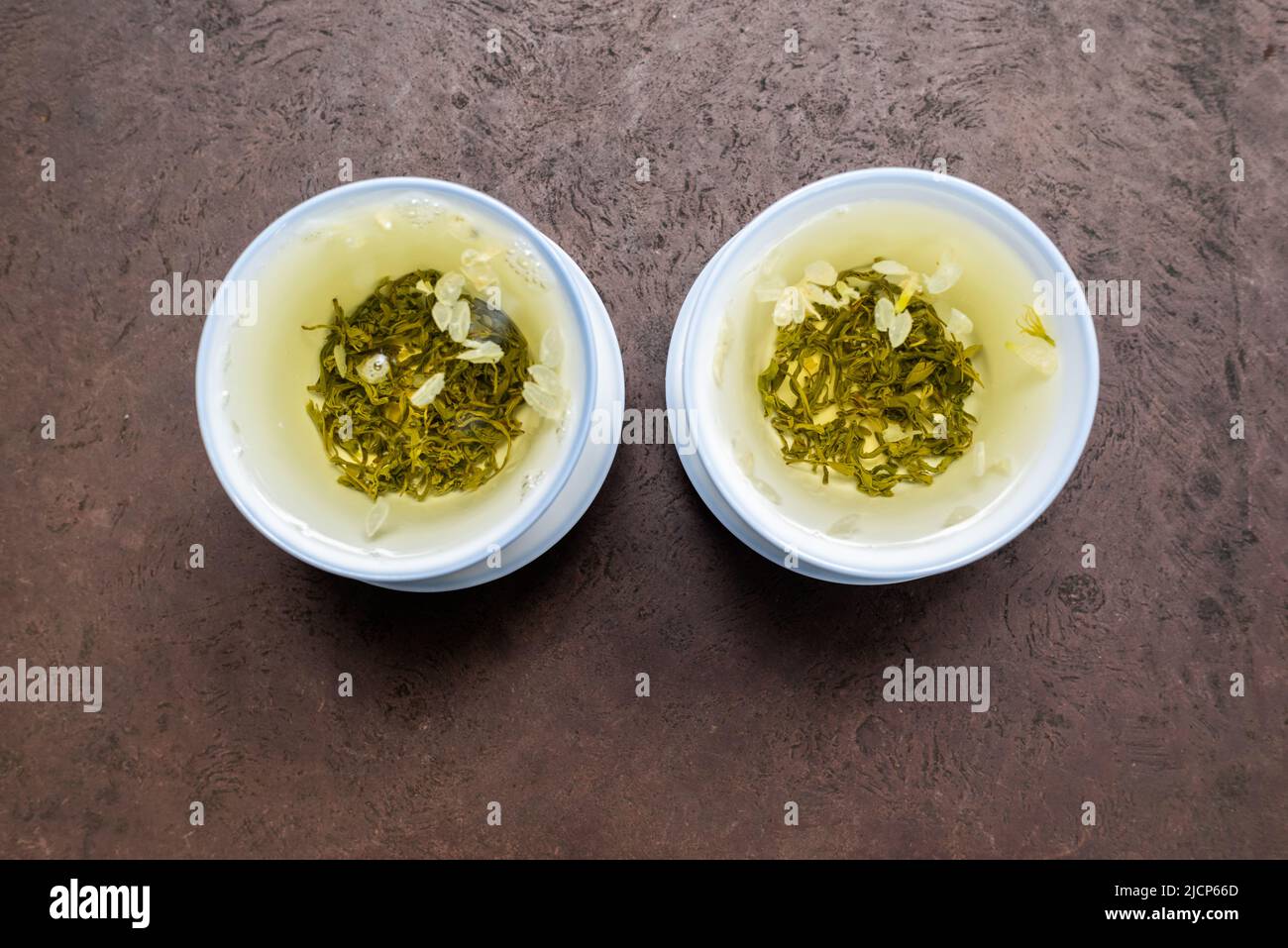 Two cups of green tea on a stone table close-up view Stock Photo