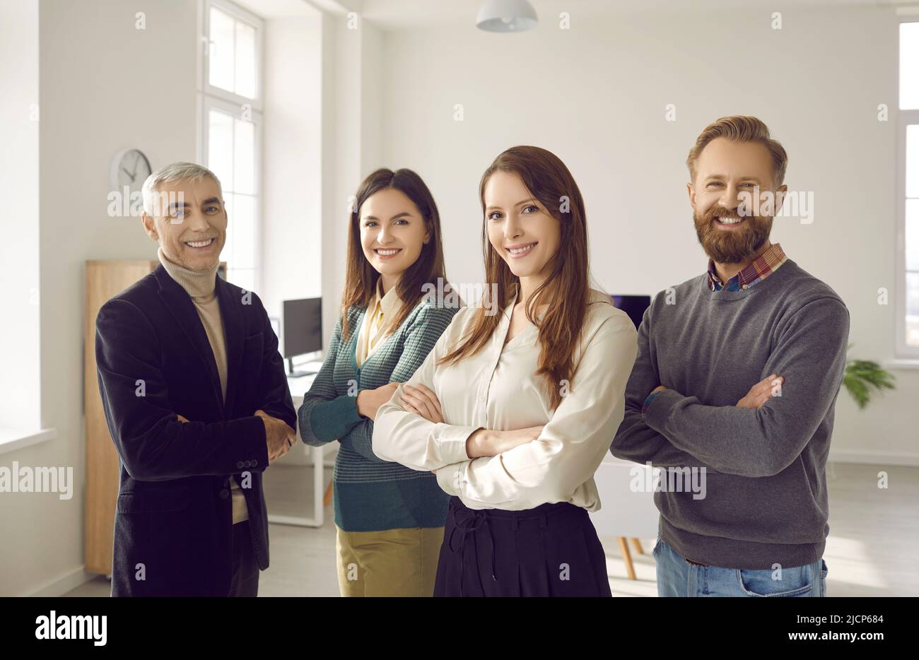 Portrait of smiling diverse businesspeople pose together Stock Photo