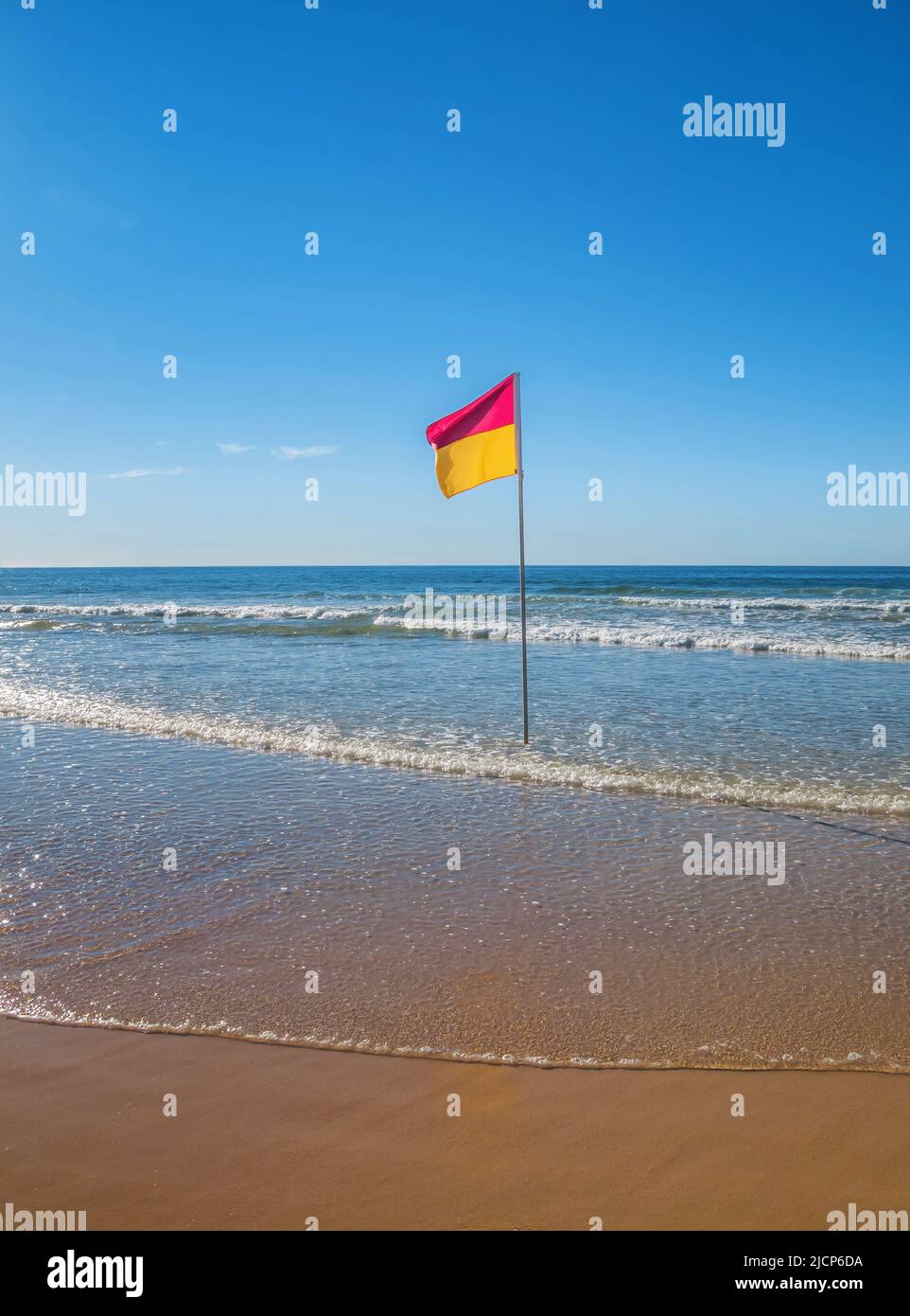 Red and yellow surf lifesaving flag on Australian beach Stock Photo Alamy