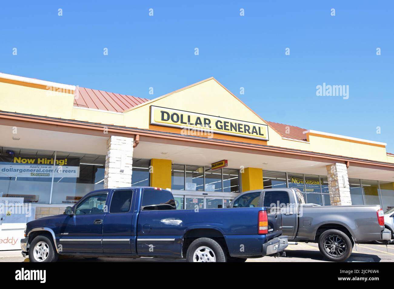Pick up trucks parked in front of a Dollar General store Stock Photo