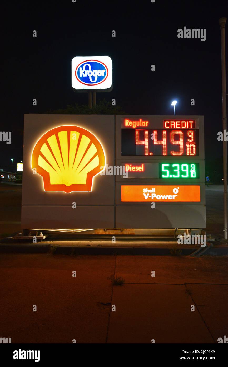 Night time photo of a Shell gas station, sign showing high gas prices
