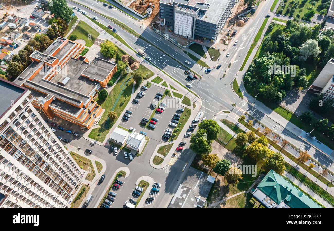 city crossroad in residential district. slow car traffic. aerial view in sunny summer day. Stock Photo