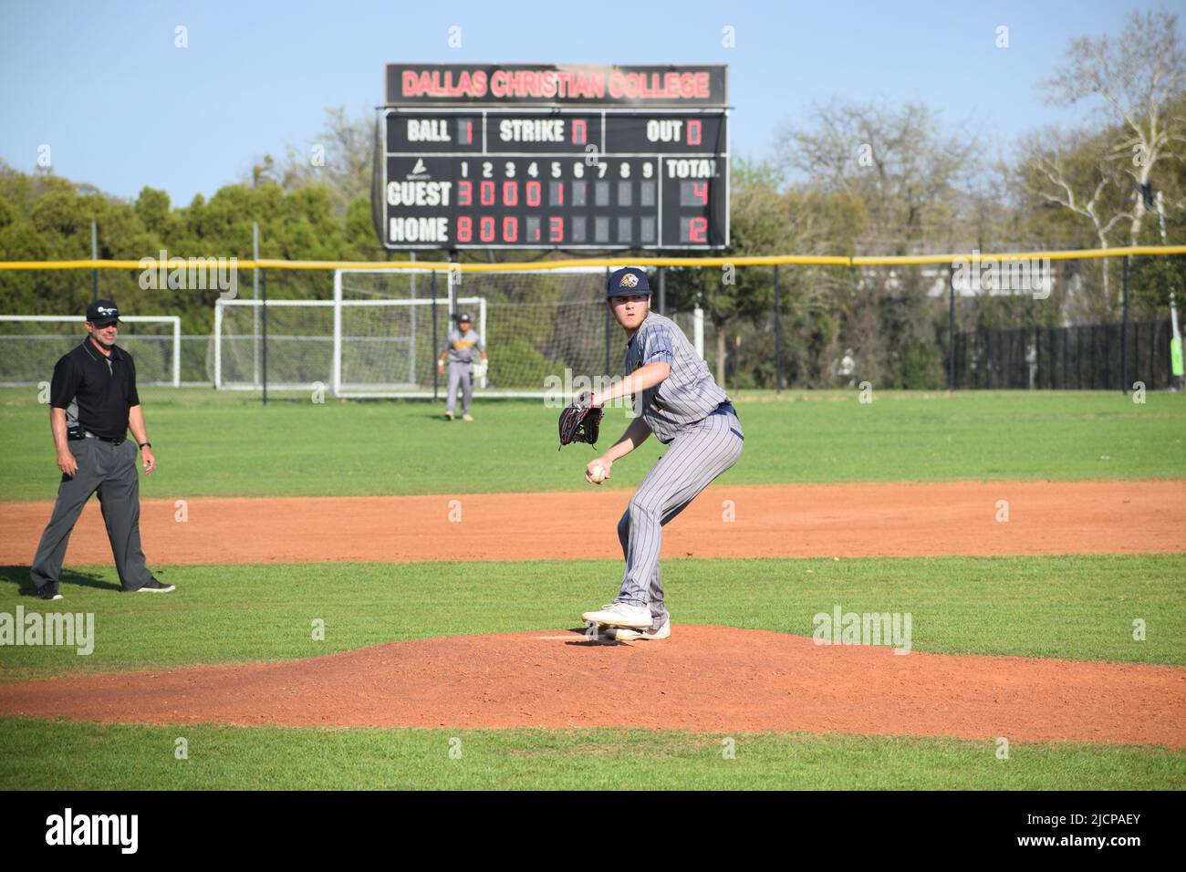 An Ecclesia College pitcher on the mound at a game against Dallas Christian College Stock Photo
