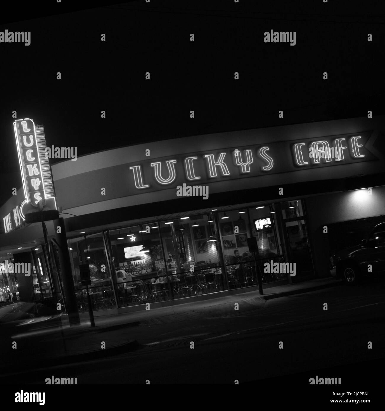 Neon signs featured on the facade of Lucky's Cafe in Dallas Texas Stock Photo