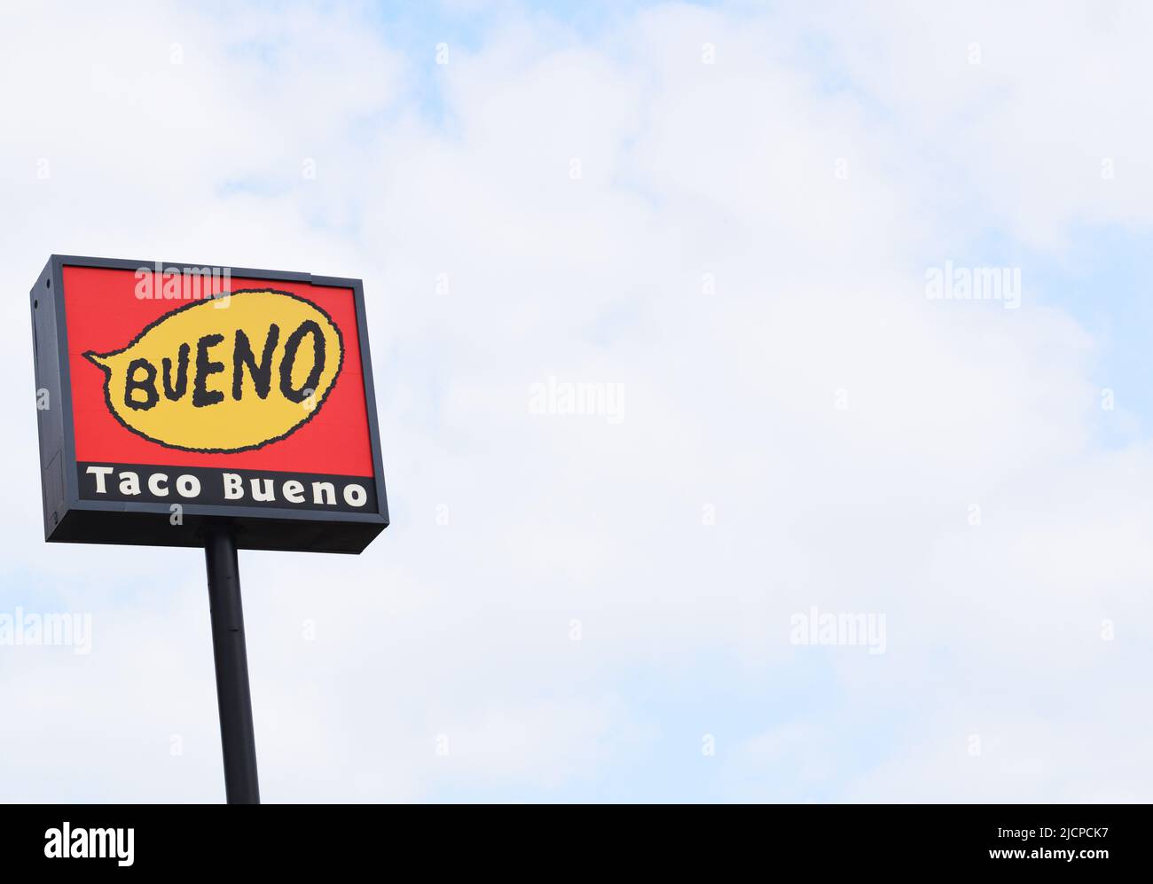 Red and yellow Taco Bueno sign on the left side of an image, copyspace Stock Photo