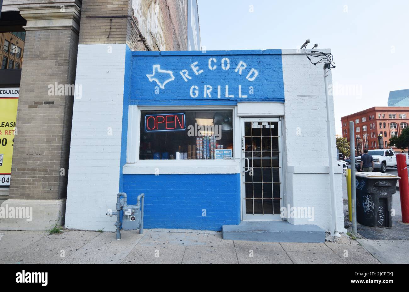 Open sign in the window of the Record Grill, a hole in the wall