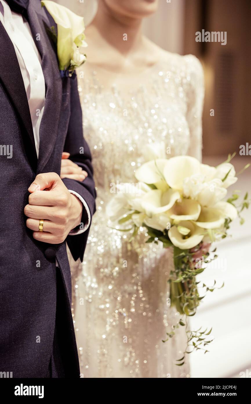 A close-up image of wedding ring of groom in wedding venue Stock Photo