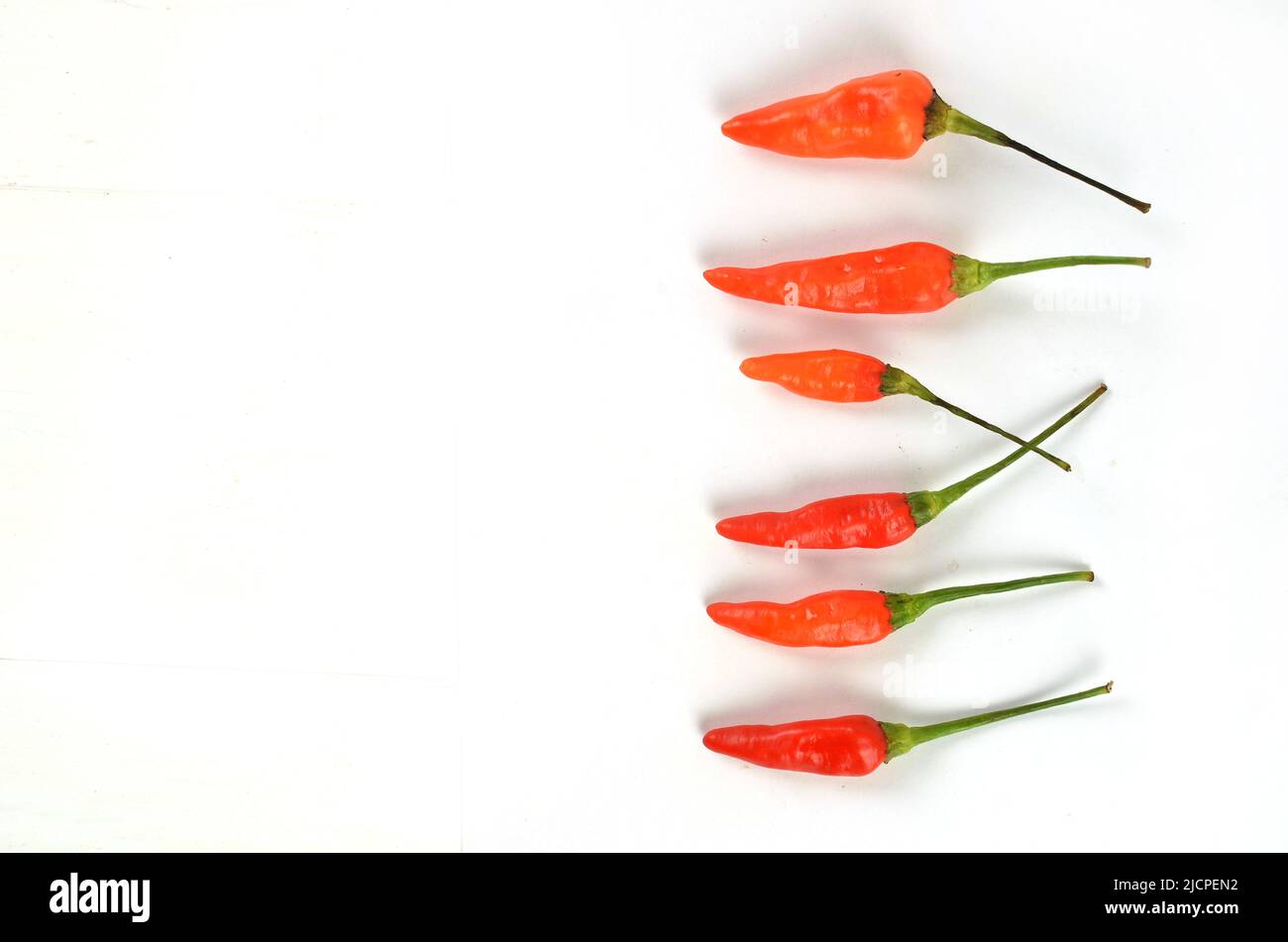Chilli peppers red and hot on white background Stock Photo Alamy