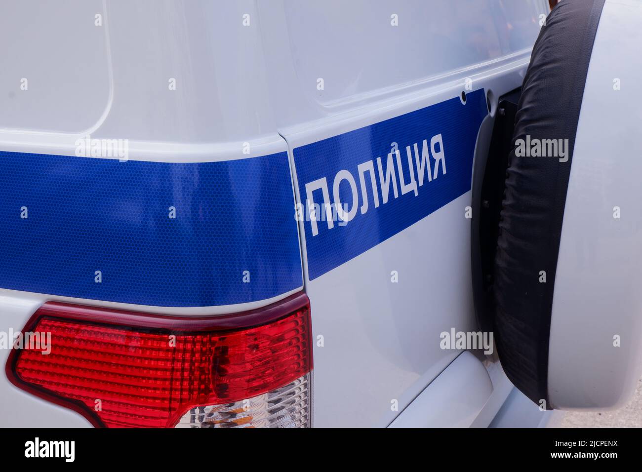 A fragment of a special official car with the inscription police in Russian. Stock Photo
