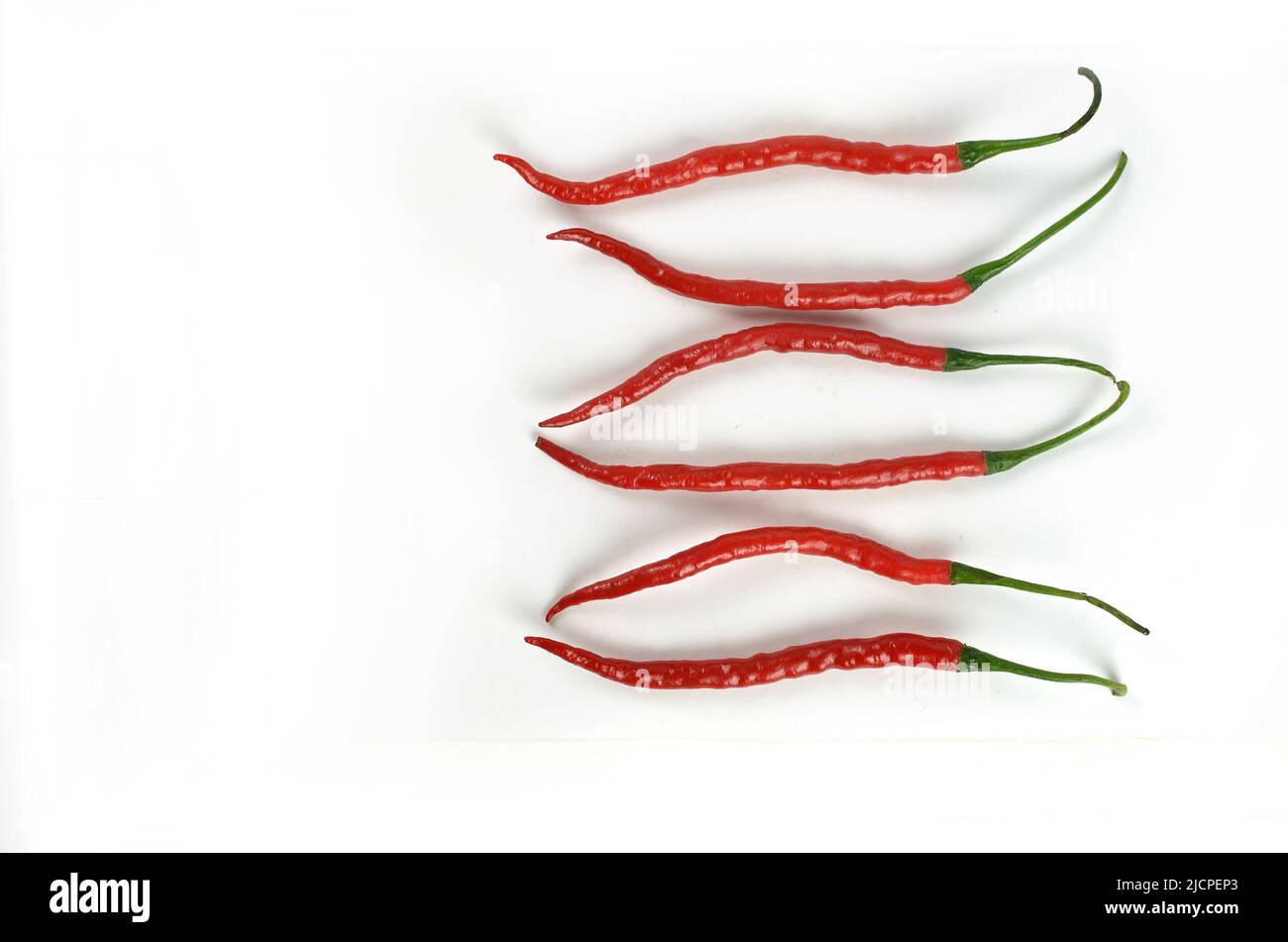 Chilli peppers red and hot on white background Stock Photo Alamy