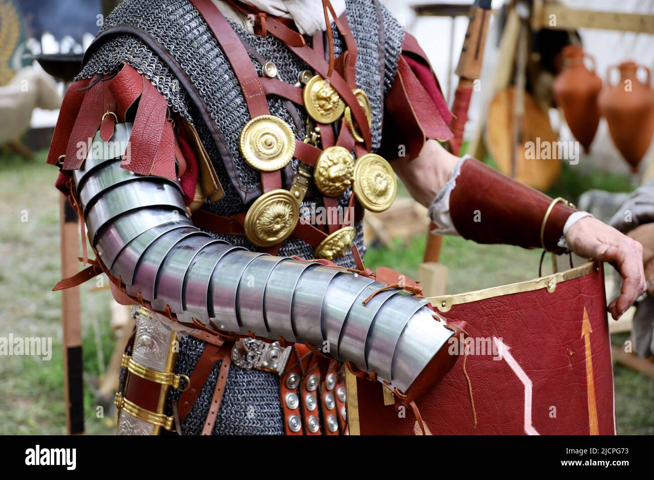 Legionary of Ancient Rome, close up of armor and scutum of infantry of Roman army on historical reconstruction festival Stock Photo
