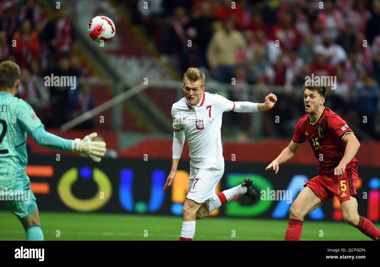 WARSAW, POLAND - JUNE 14, 2022: UEFA Nations League 2023 Poland - Belgium game o/p: Karol Swiderski (Poland) Thomas Foket (Belgium) Stock Photo