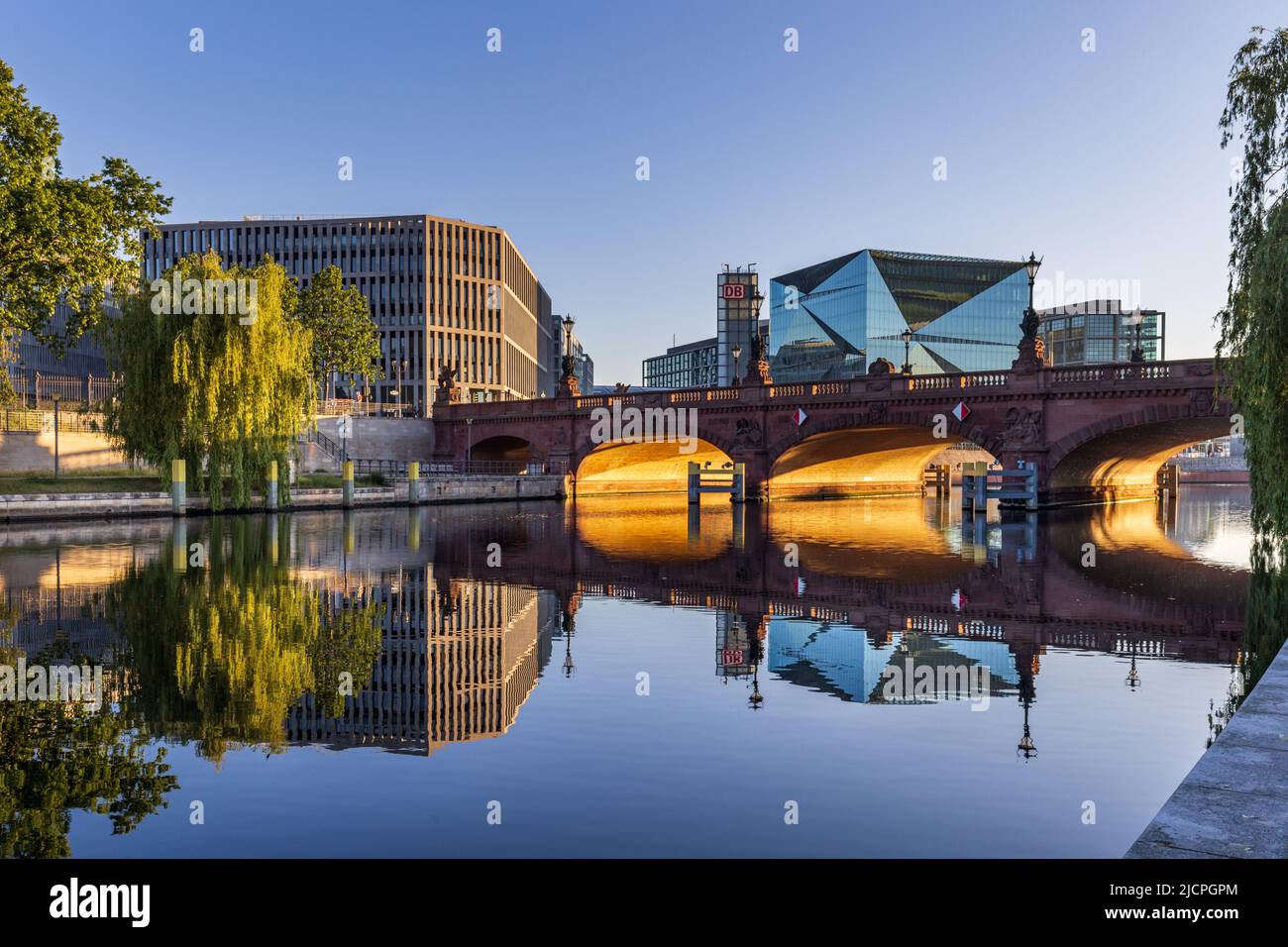 The beautiful stone Moltke Bridge over the Spree River, with Cube Berlin and Berlin Hauptbahnhof in the background. Stock Photo