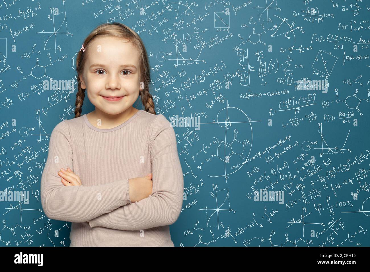 Successful female career concept. Cheerful little girl math student on
