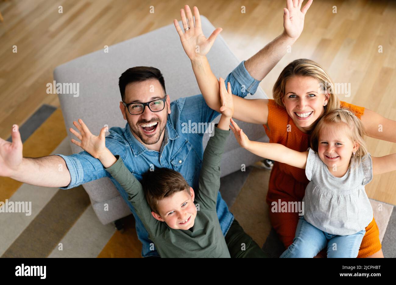 Happy family having fun time at home. Parents children love happiness concept. Stock Photo