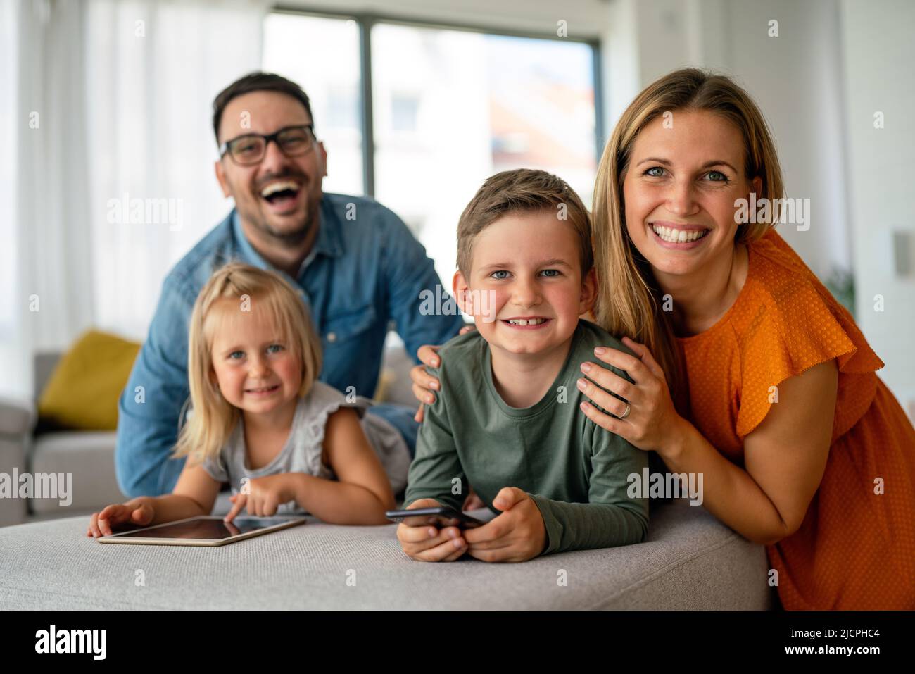 Device technology family online education concept. Happy family with ...